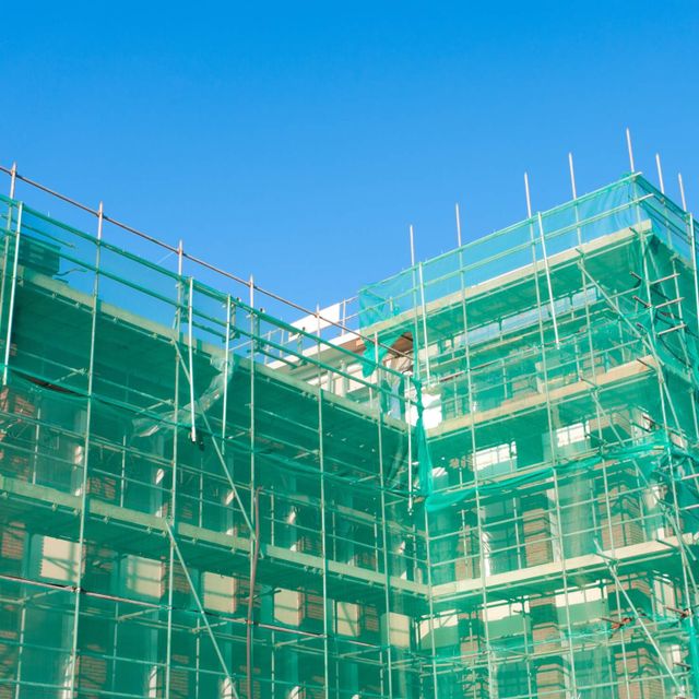 Building Covered with safety Netting for construction